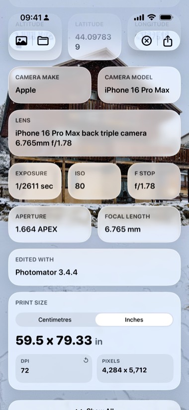 Metadata showing camera make, model, lens, exposure and ISO over a photograph of a chalet in snow